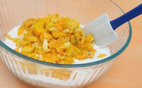 Image of chopped kumquats mixed with dry ingredients