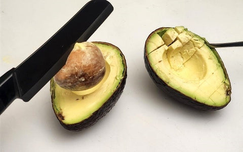 Image of pitted avocado, cut in half