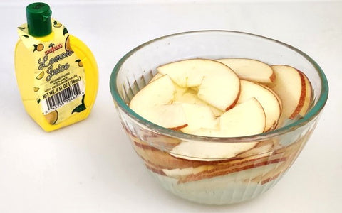Image of apple slices in bowl with lemon juice