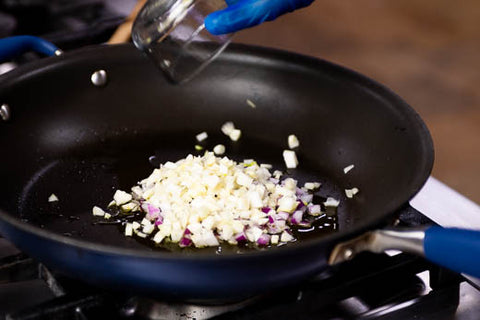 Image of onions in heated pan
