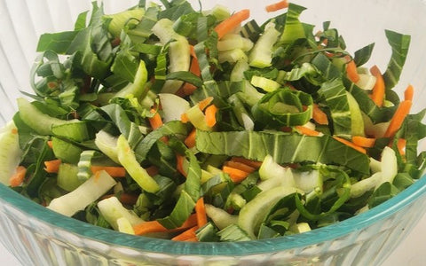 Image of salad ingredients mixed in a serving bowl