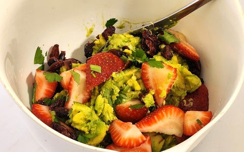 Image of strawberries and guacamole in a mixing bowl