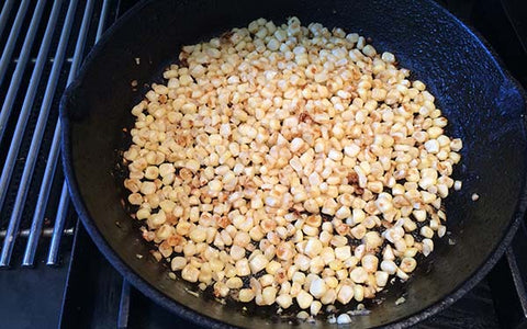 Image of Heat a large cast-iron skillet with 1 tsp. of corn oil on medium heat until hot and add corn kernels