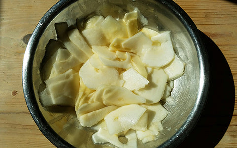 Image of Peel pears with a vegetable peeler, cut in half and core. Remove the inner string from center of Bartlett pears. Using a mandoline, slice pears into ¼-inch disks and place in a big bowl. Squeeze lemon juice over pears and toss to coat, and set aside. * If pears are too wide to use mandoline, cut off excess pear from one side to fit and slice these pieces into strips.