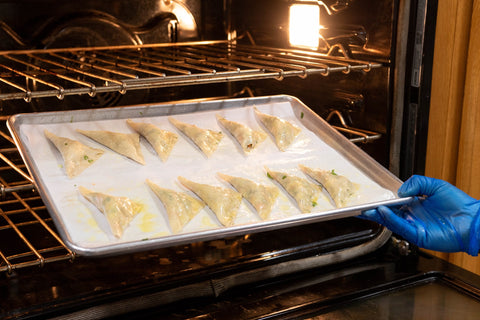 Image of wontons arranged on baking tray