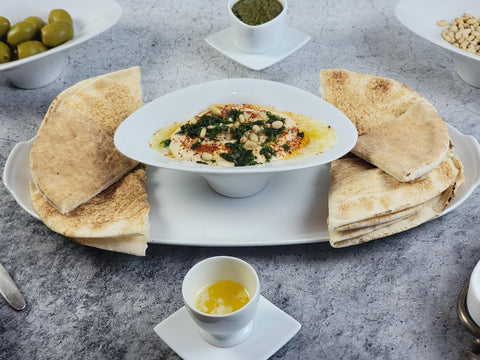Image of Turkish-Style Hummus with Feta Cheese Toasted Pine Nuts and Marinated Olives