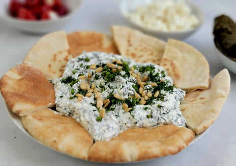 Image of Turkish-Style Yogurt Spinach Dip with Pita Bread, Feta Cheese and Stuffed Peppers