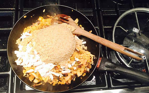 Image of adding quinoa to sauteed veggies