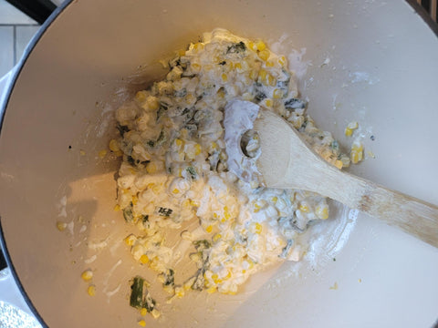 Image of adding mayo and crema to mixed ingredients