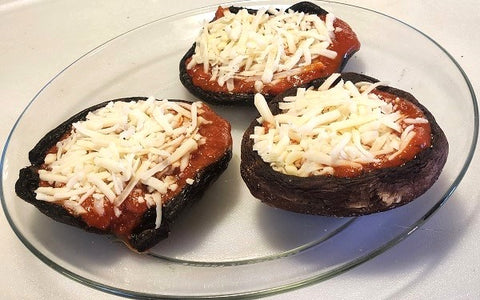 Image of portobello mushrooms with tomato sauce and cheese