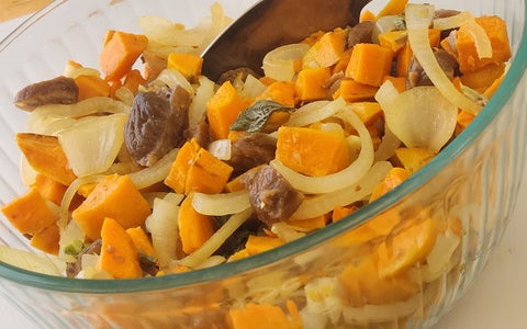 Image of mixing onions and sweet potatoes on a bowl