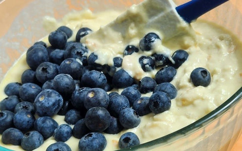 Image of adding blueberries to muffin mixture