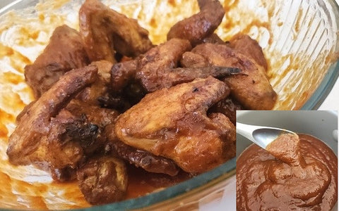 Image of chicken wings coated with sauce