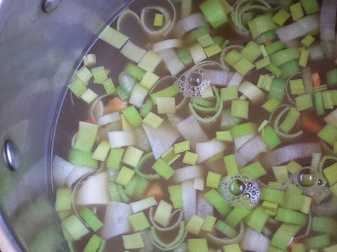Image of Combine water from chicken and store-bought broth in a large soup pot, then bring to boil