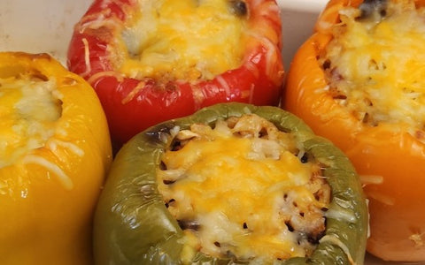 Image of stuffed pepper with grated cheese on top