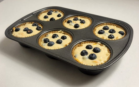 Image of batter divided into muffin cups