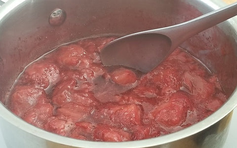 Image of strawberries cooking in a pan