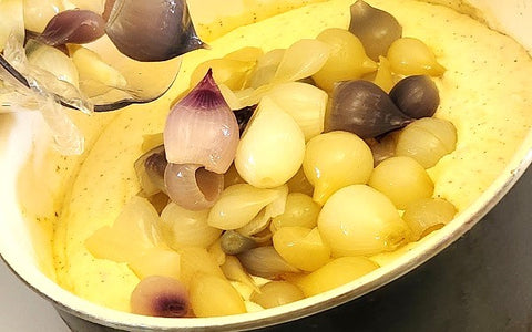 Image of onions and cheese sauce