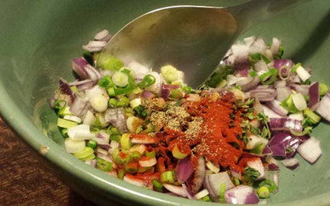 Image of mixing salad ingredients 