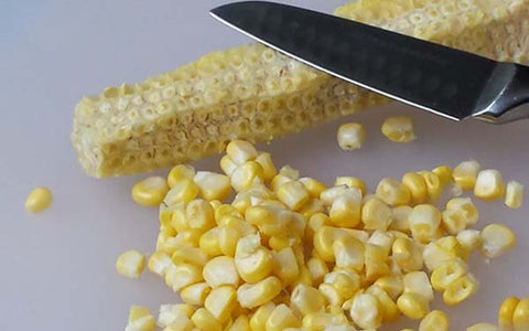 Image of removing fresh corn from the cob
