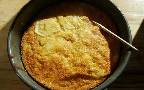 Image of Let cake cool on a wire rack for 20 minutes. The cake should have pulled back from pan ring, but if not, run a knife around the rim between the cake and pan to loosen. Remove pan ring and let cool about 20 minutes more. Dust with powdered sugar and garnish with a sprig of mint