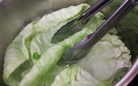 Image of Separate 8 large leaves from cabbage head and boil until slightly tender