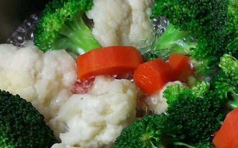 Image of Add broccoli and steam for another 4 minutes, then drain veggies and set aside