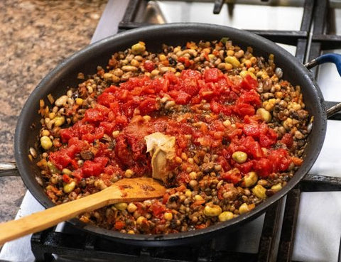 Image of diced tomatoes and peanut butter in veggies and beans saute