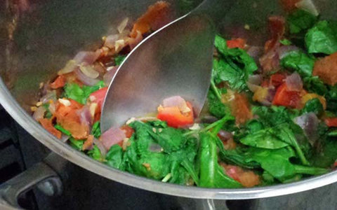 Image of adding spinach to veggies sauté