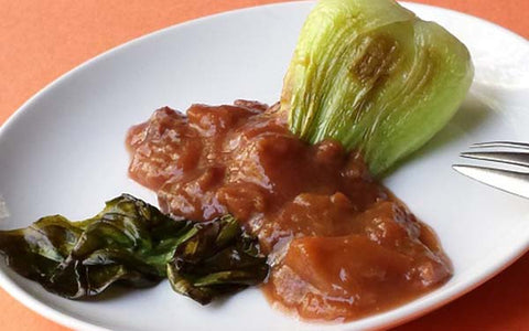 Image of Pour the sauce right over the braised bok choy. This dish can be plated individually (one baby bok choy is the perfect child’s serving) or plate family style on a large platter