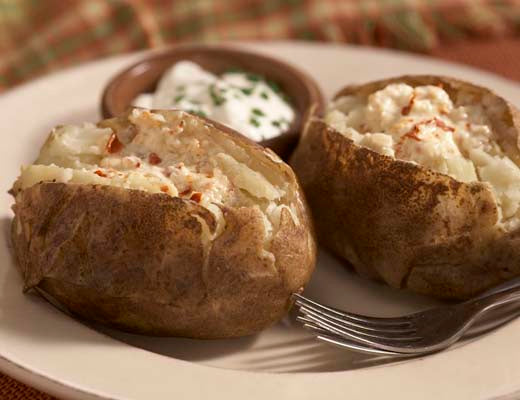 Image of Baked Potatoes with Pepper Flake Garlic Butter and Sour Cream