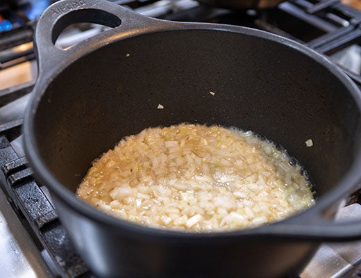 Image of onions cooking in a pot