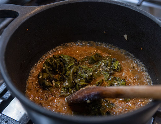 Image of roasted hatch peppers added to chile verde stew