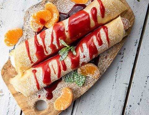 Image of Pixie Tangerine Crepes with Melissa's Raspberry Sauce