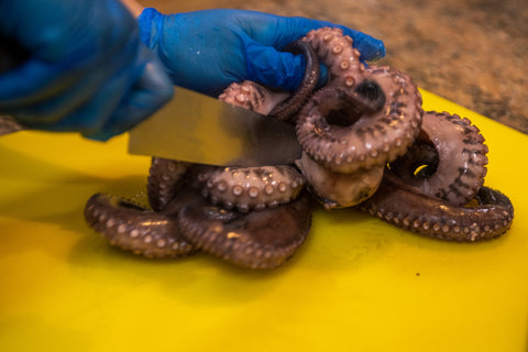 Image of cutting octopus on a cutting board