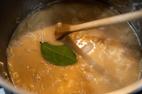 Image of onion soup preparation in Dutch oven