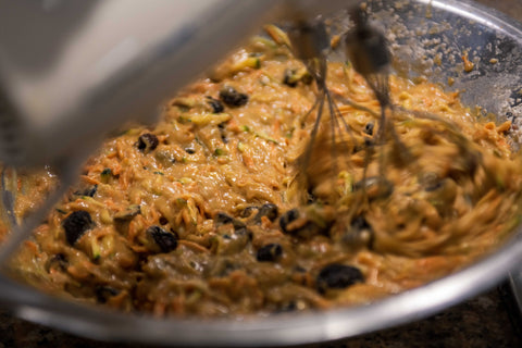 Image of blended cake batter with dried cherries