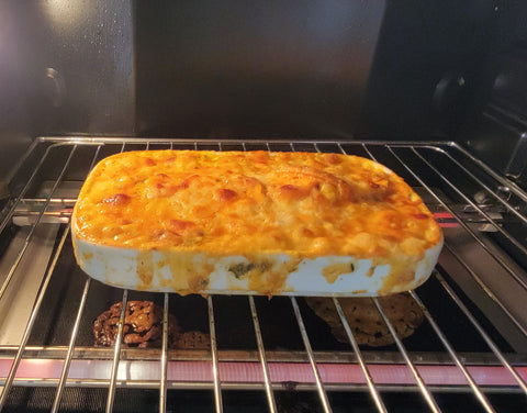 Image of potatoes au gratin in oven