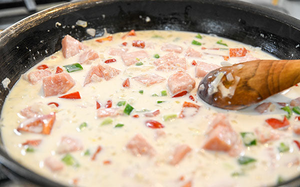 Image of coconut milk added to curry