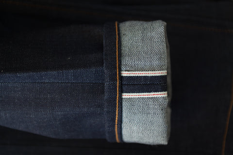 Cone Mills Red Line 130z raw selvedge indigo denim. Made in USA