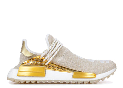 human race shoes gold