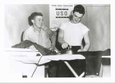 Service members ironing uniforms at USO