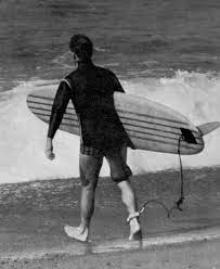 Surfer using a surf leash on surfboard