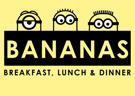 Three minions peek out from a bananas sign with "Bananas Breakfast, Lunch, & Dinner" underneath