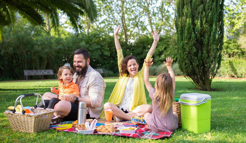 Lovely family with wife, husband and their two kids having a picnic in Cape Town