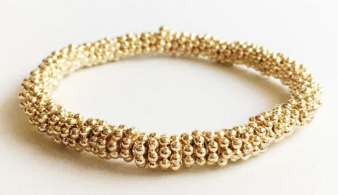 yellow gold beaded bracelet