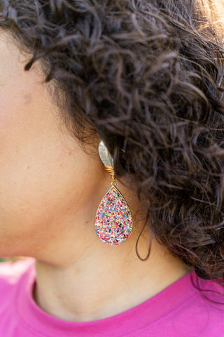 glitter teardrop statement earrings modeled on woman