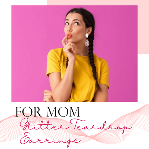 woman with braids wearing yellow shirt and glitter teardrop statement earrings