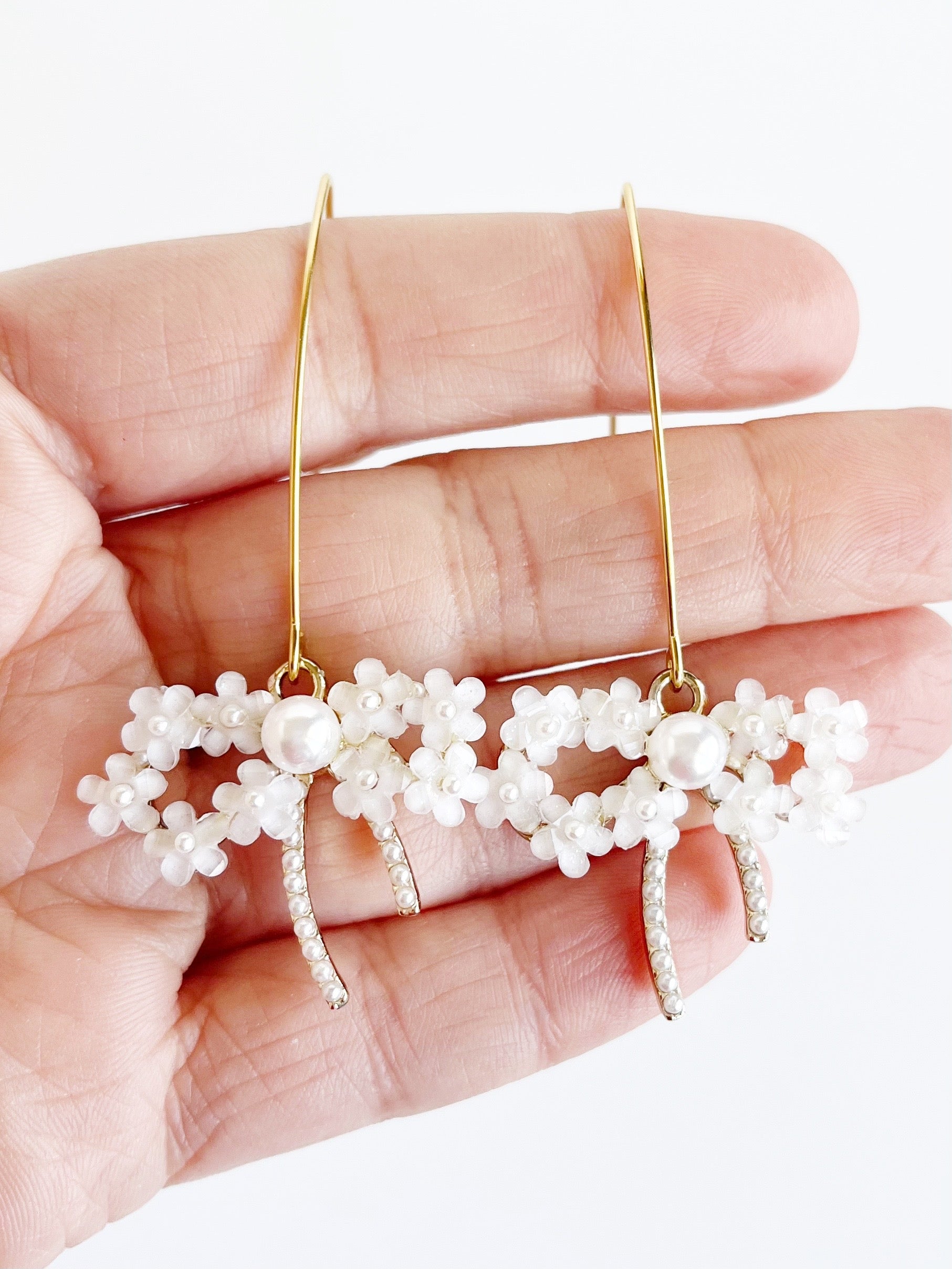 long-pearl-bow-earrings