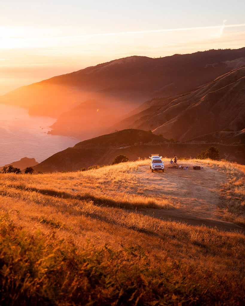 Car camping during a beautiful sunset in the fall at Big Sur